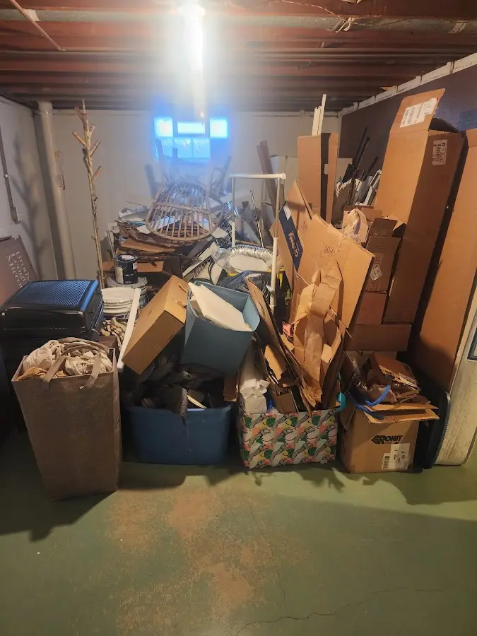 Roll-off dumpster container at job site for 2 Yard Dumpster Rental in Lesslie